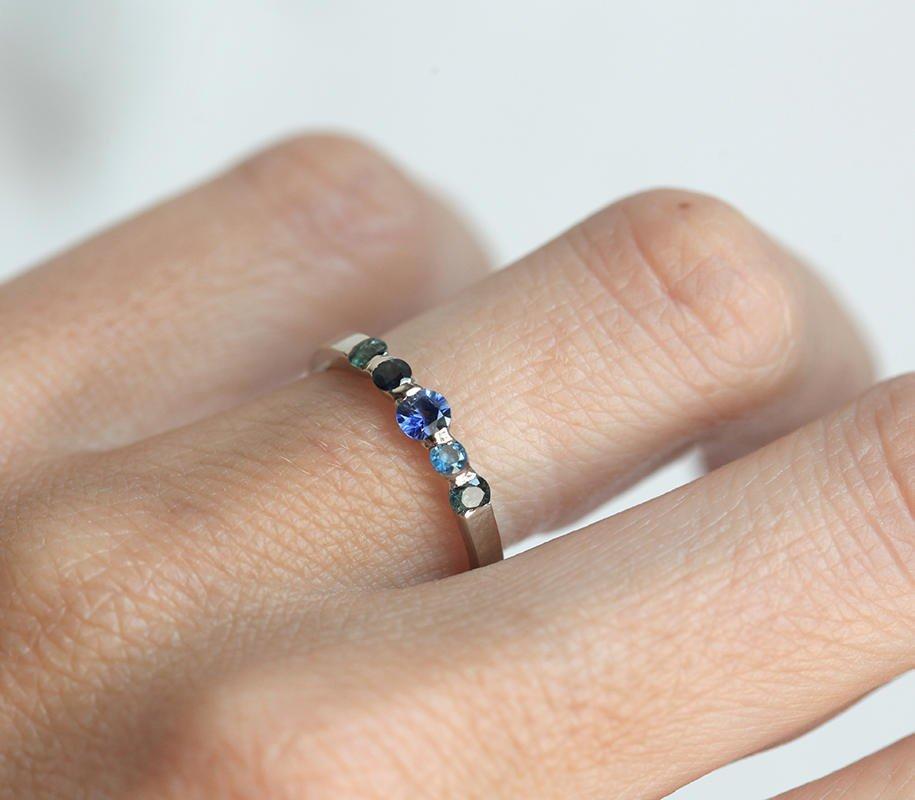 Round blue sapphire wedding ring with side sapphires