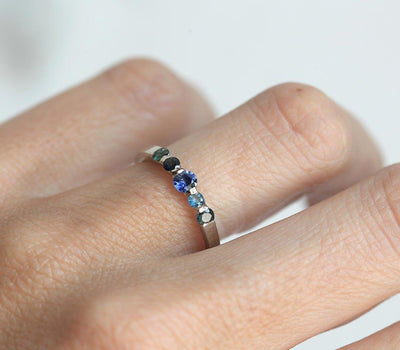 Round blue sapphire wedding ring with side sapphires