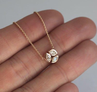 Solid gold necklace with three marquise-cut white diamonds