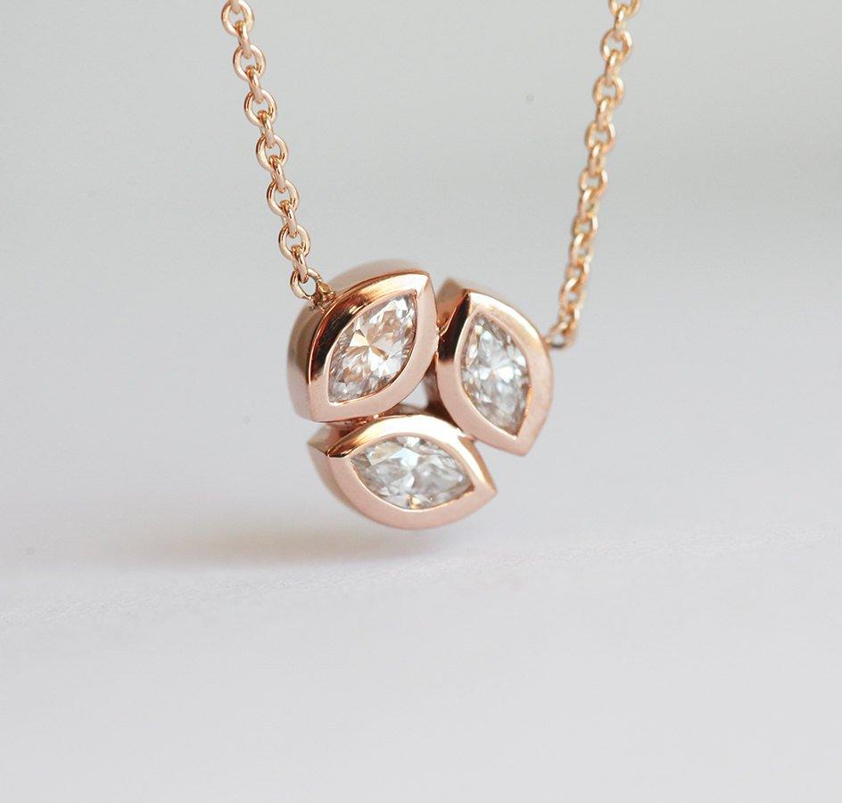 Solid gold necklace with three marquise-cut white diamonds