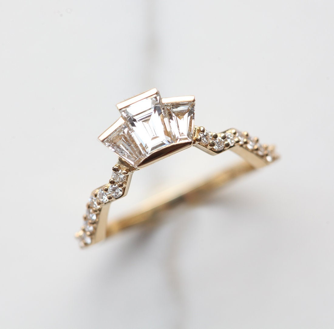 Baguette-shaped white diamond ring with diamond pave