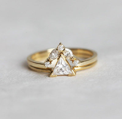 Marquise-cut white diamond ring with round diamond side stones