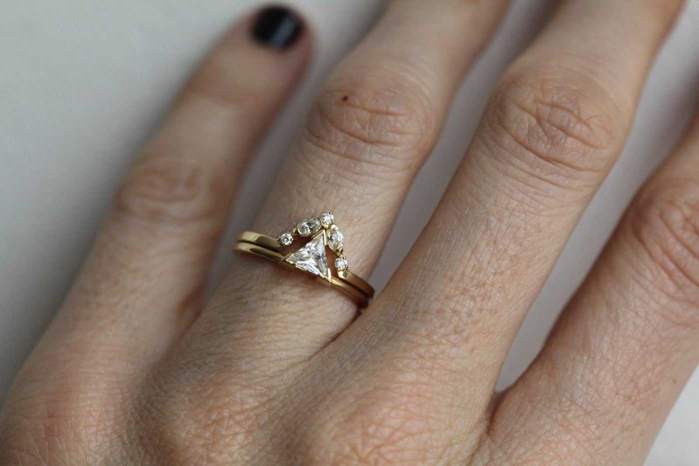 Marquise-cut white diamond ring with round diamond side stones