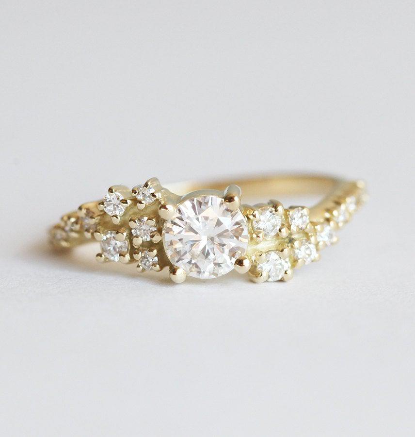 Round white moissanite ring with white diamond cluster