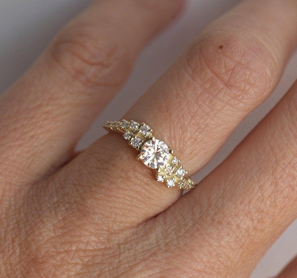 Round white moissanite ring with white diamond cluster
