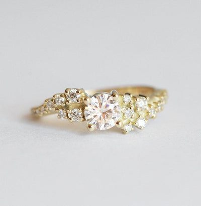 Round white moissanite ring with white diamond cluster