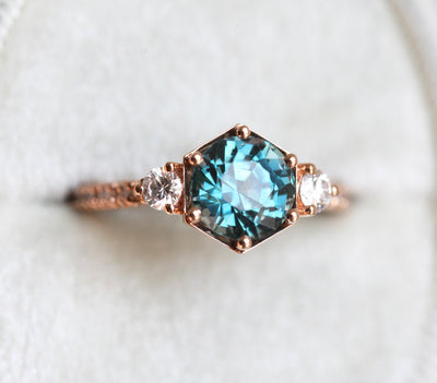 Round teal green sapphire ring with white diamonds