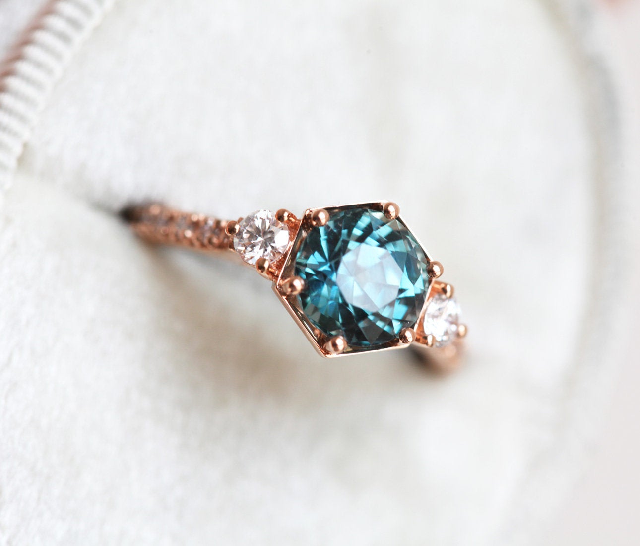 Round teal green sapphire ring with white diamonds