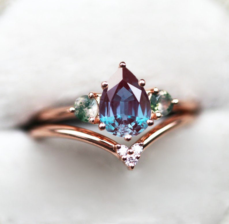 Pear Alexandrite Ring with 2 Side Round Moss Agate Stones and a V-Shaped Diamond Band