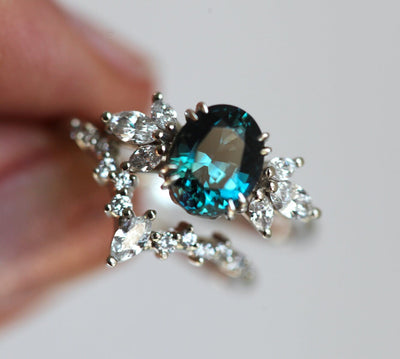 Oval-shaped black opal and white diamond ring set