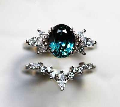Oval-shaped blue ceylon sapphire and white diamond engagement ring set