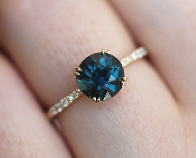 Round teal sapphire ring with white diamonds