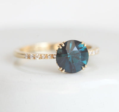 Round teal sapphire ring with white diamonds