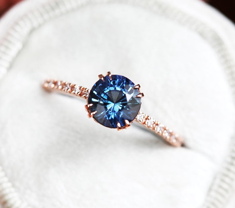 Round teal sapphire ring with white diamonds