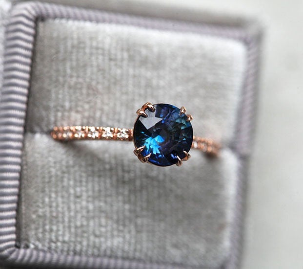 Round teal sapphire ring with white diamonds