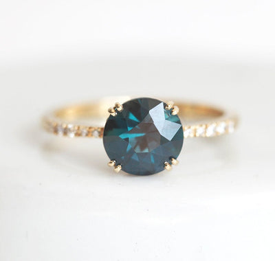 Round teal sapphire ring with white diamonds