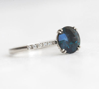 Round teal sapphire ring with white diamonds