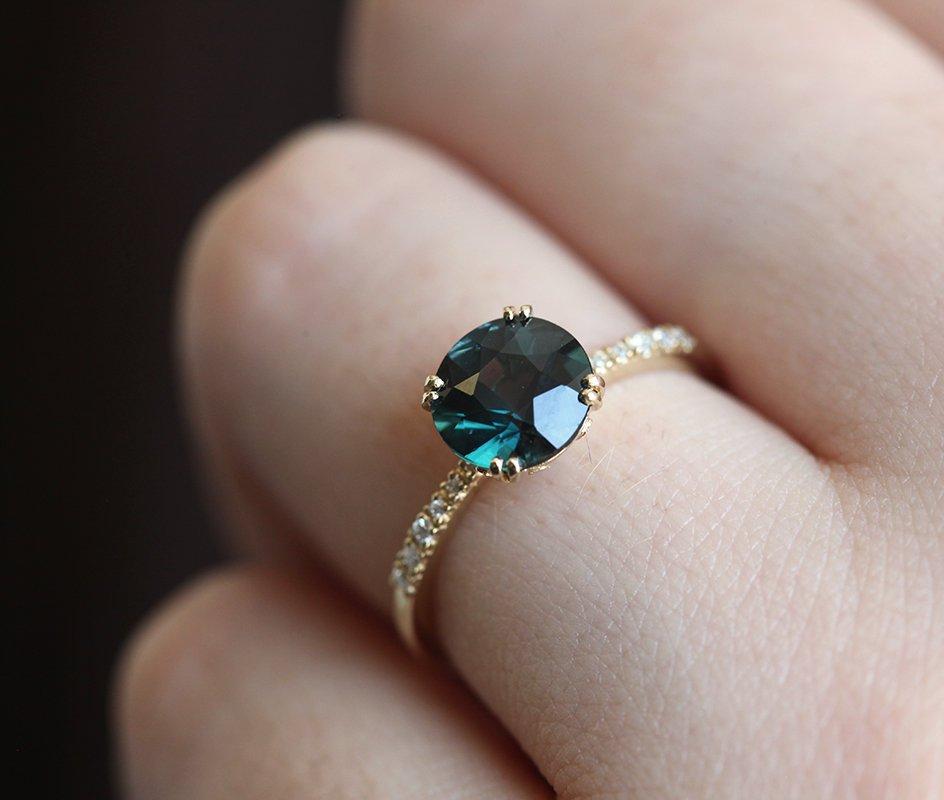 Round teal sapphire ring with white diamonds