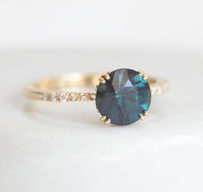 Round teal sapphire ring with white diamonds