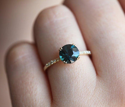 Round teal sapphire ring with white diamonds