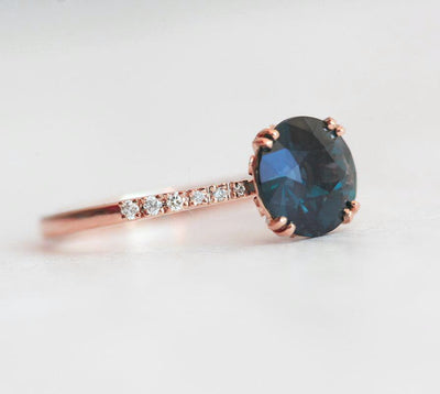 Round teal sapphire ring with white diamonds