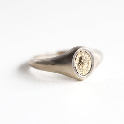 Minimalist platinum signet ring featuring Virgin Mary, 7x5mm. Customizable with gemstones. Free insured shipping.