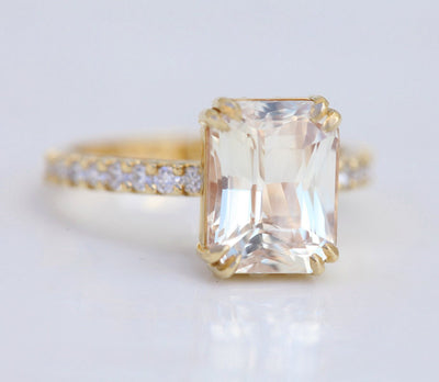 Radiant-cut light peach eternity ring with white diamonds