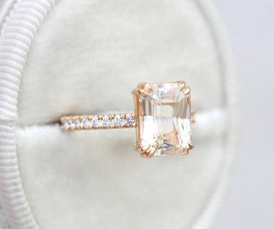Radiant-cut light peach eternity ring with white diamonds