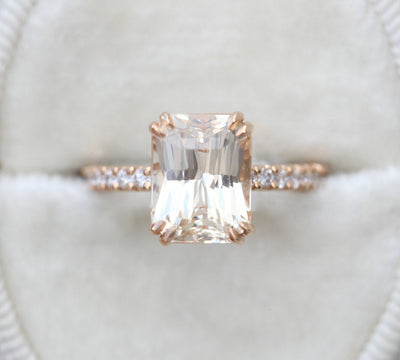 Radiant-cut light peach eternity ring with white diamonds