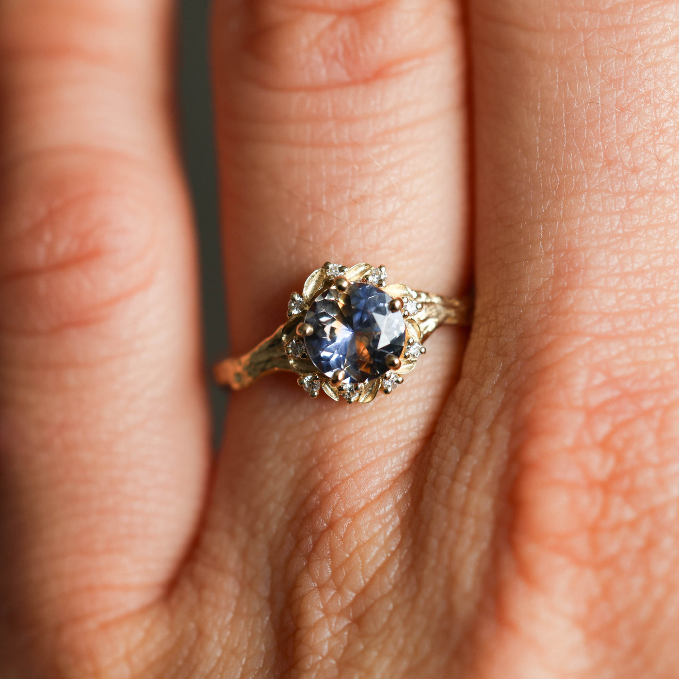 Whimsical round bicolor sapphire engagement ring