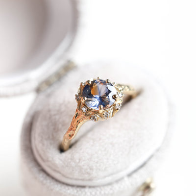 Whimsical round bicolor sapphire engagement ring