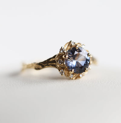 Whimsical round bicolor sapphire engagement ring