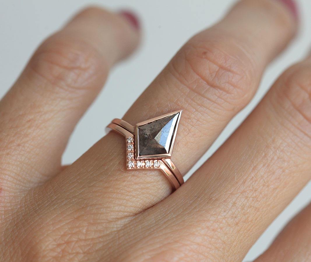 Nested round white diamond ring with kite-shaped black salt and pepper diamond ring