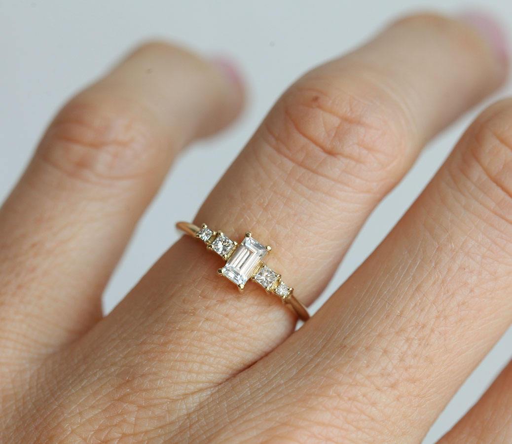 Vintage baguette-shaped white sapphire engagement ring with diamonds