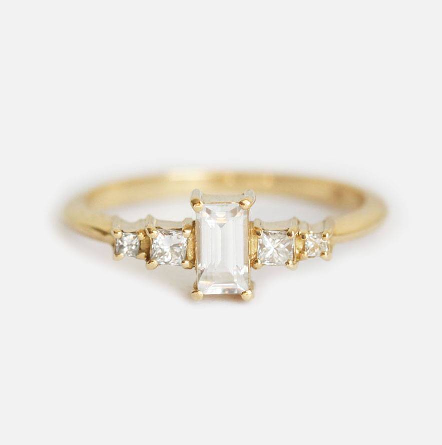 Vintage baguette-shaped white sapphire engagement ring with diamonds