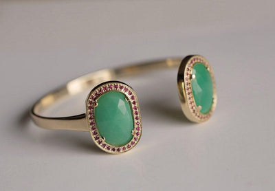 Wide cuff gold bracelet with oval green chrysoprase gems and ruby halos