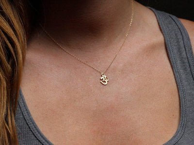 Gold ohm necklace