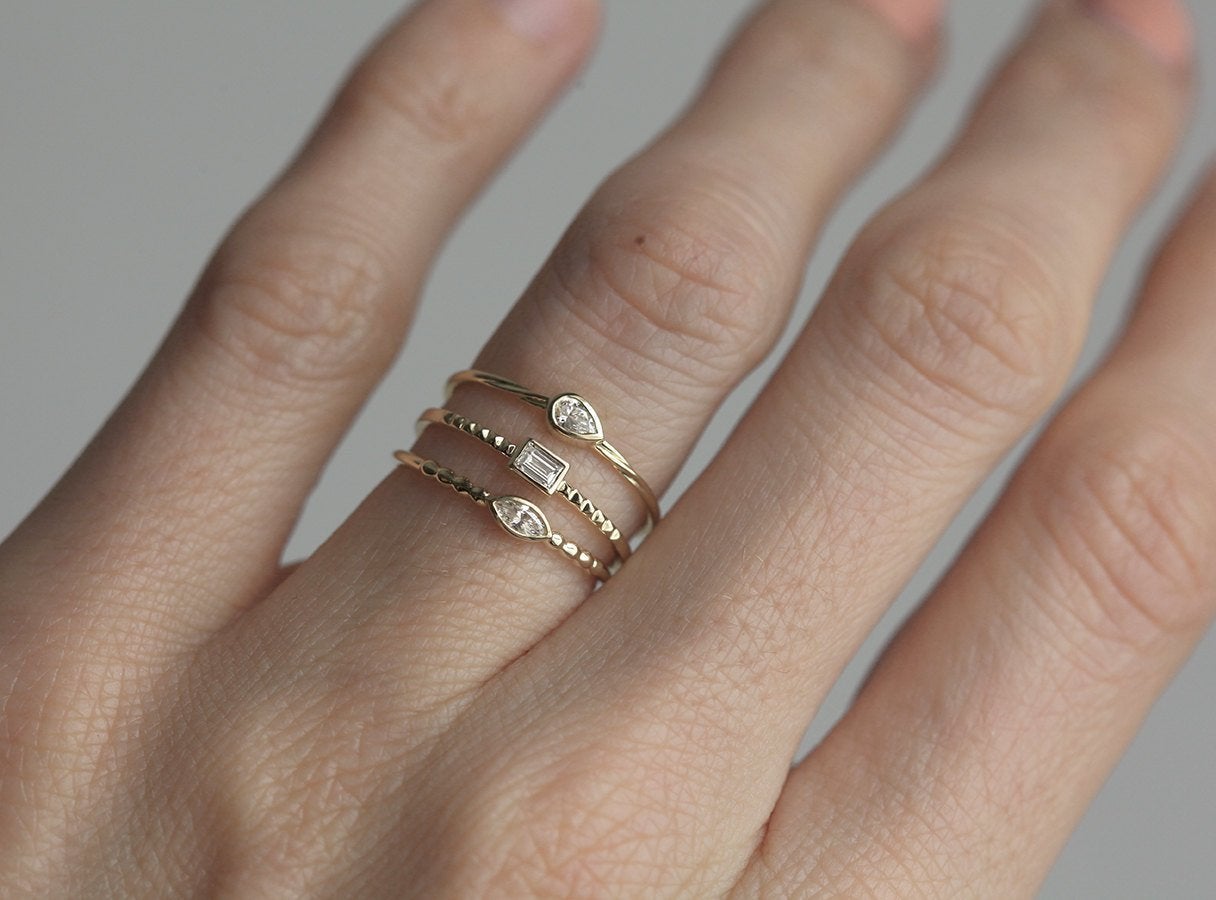 Pear-shaped white diamond ring