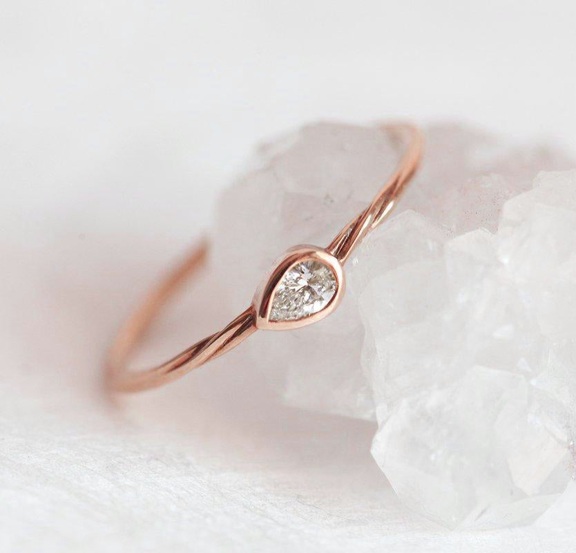 Pear-shaped white diamond ring