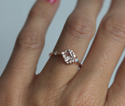 Square-shaped pink tourmaline cluster ring with white side diamonds