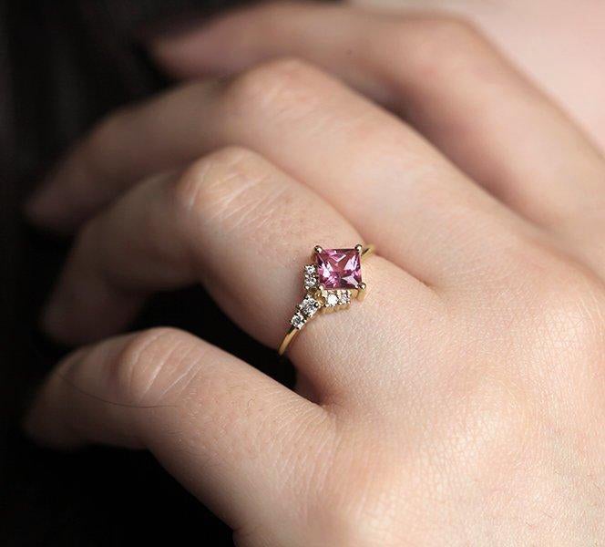 Square-shaped pink tourmaline cluster ring with white side diamonds