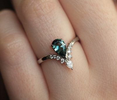 Pear-shaped teal sapphire prong ring with white diamonds