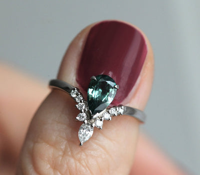 Pear-shaped teal sapphire prong ring with white diamonds