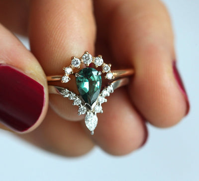 Pear-shaped teal sapphire prong ring with white diamonds