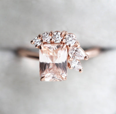Radiant-cut peach sapphire cluster ring with white diamonds