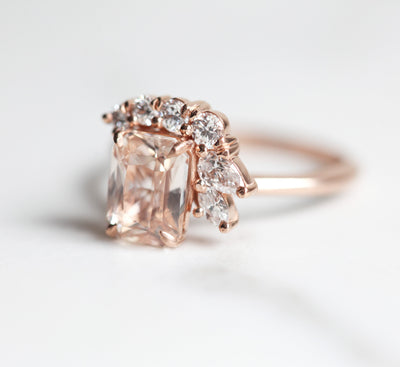 Radiant-cut peach sapphire cluster ring with white diamonds