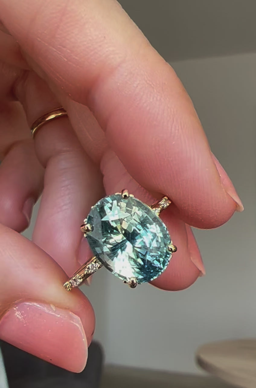 Mint-colored oval sapphire engagement ring with side diamonds video