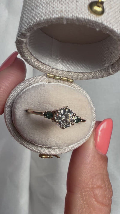 Round white diamond ring with teal pear-shaped sapphires video