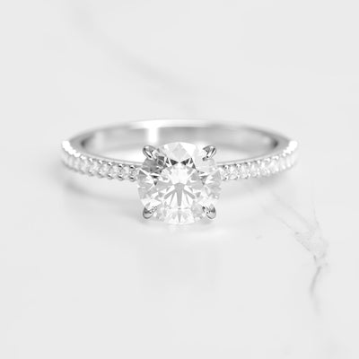 Round half pave tapered moissanite eternity ring