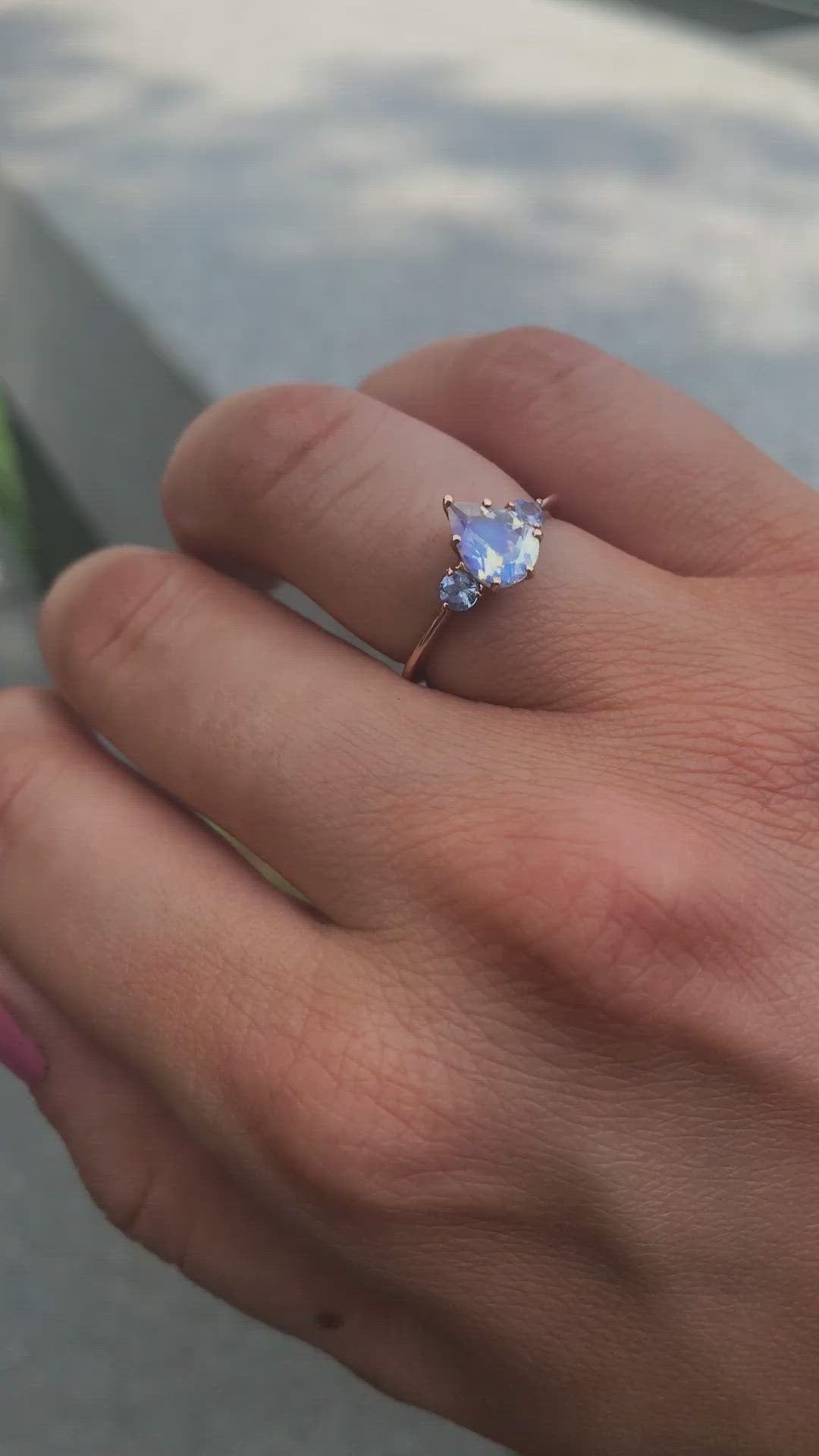 Pear-shaped white moonstone ring with side sapphires video
